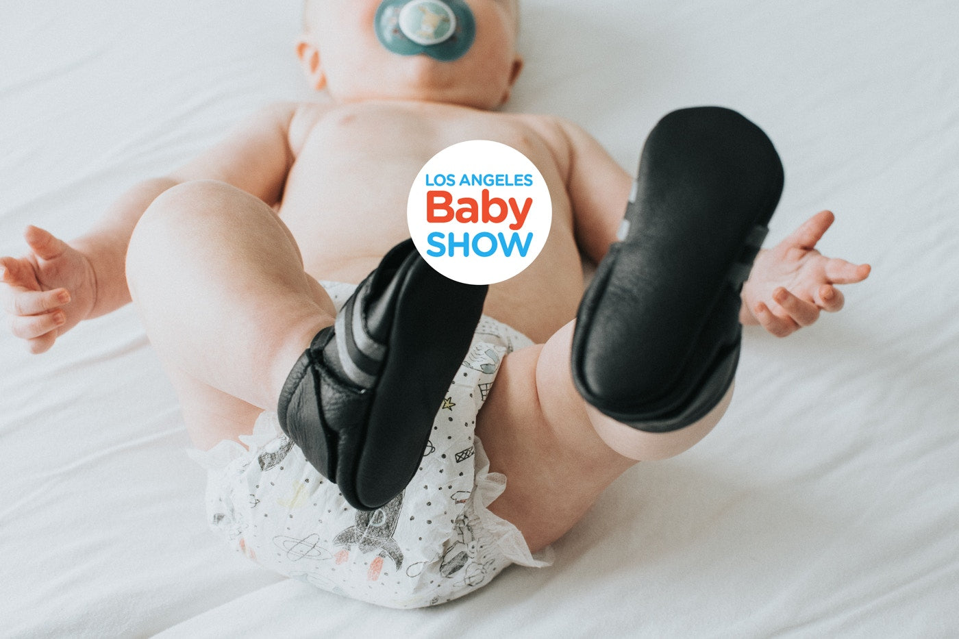 los angeles baby show logo with a baby