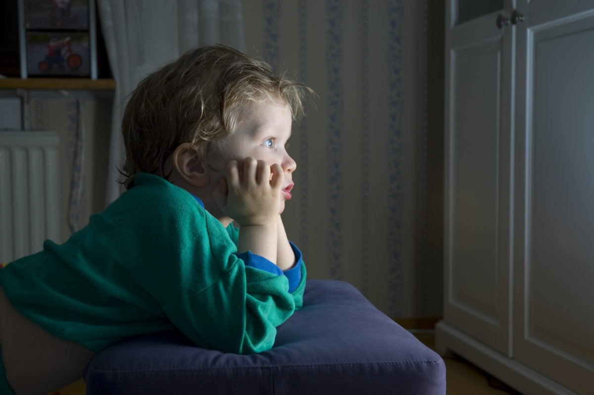 boy looking at tv