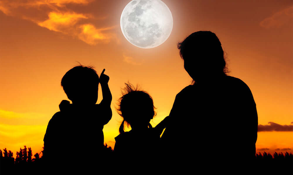 family looking at the moon