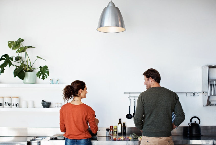 couple working in kitchen