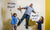 children standing  with boards father sticked on the wall behind them