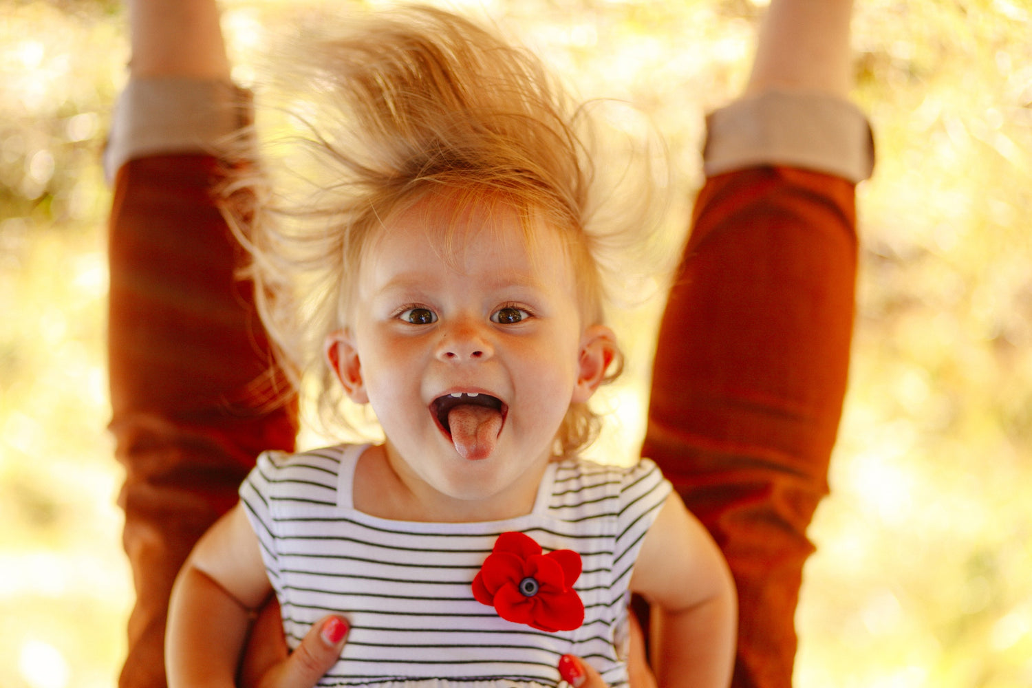 little girl upside down image