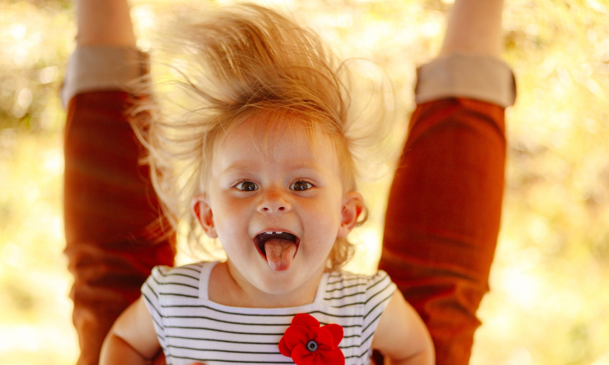 little girl upside down image