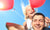 young girl sitting on daddy with two balloons.