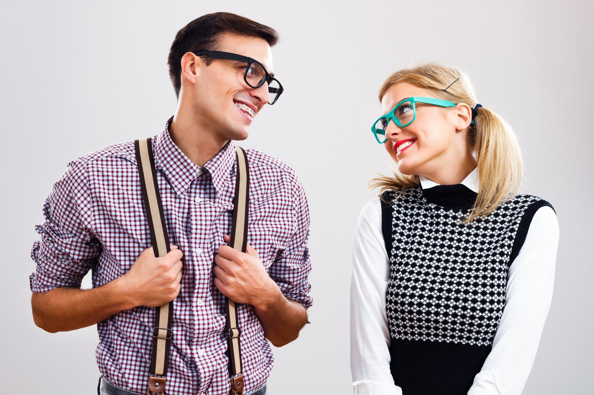 Young man and woman smiling at each other