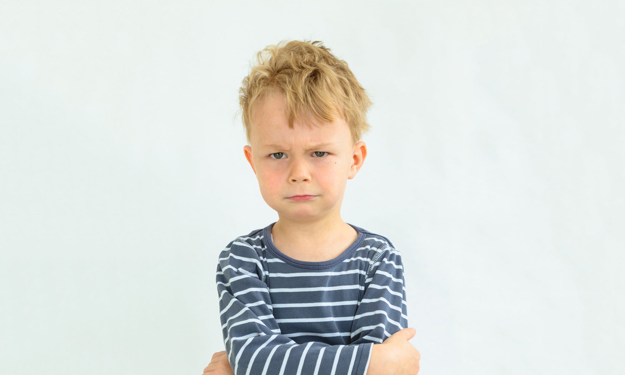 angry boy with arms crossed