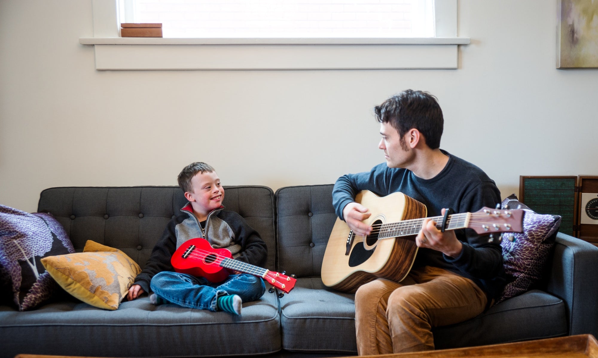 kid playing with guitar