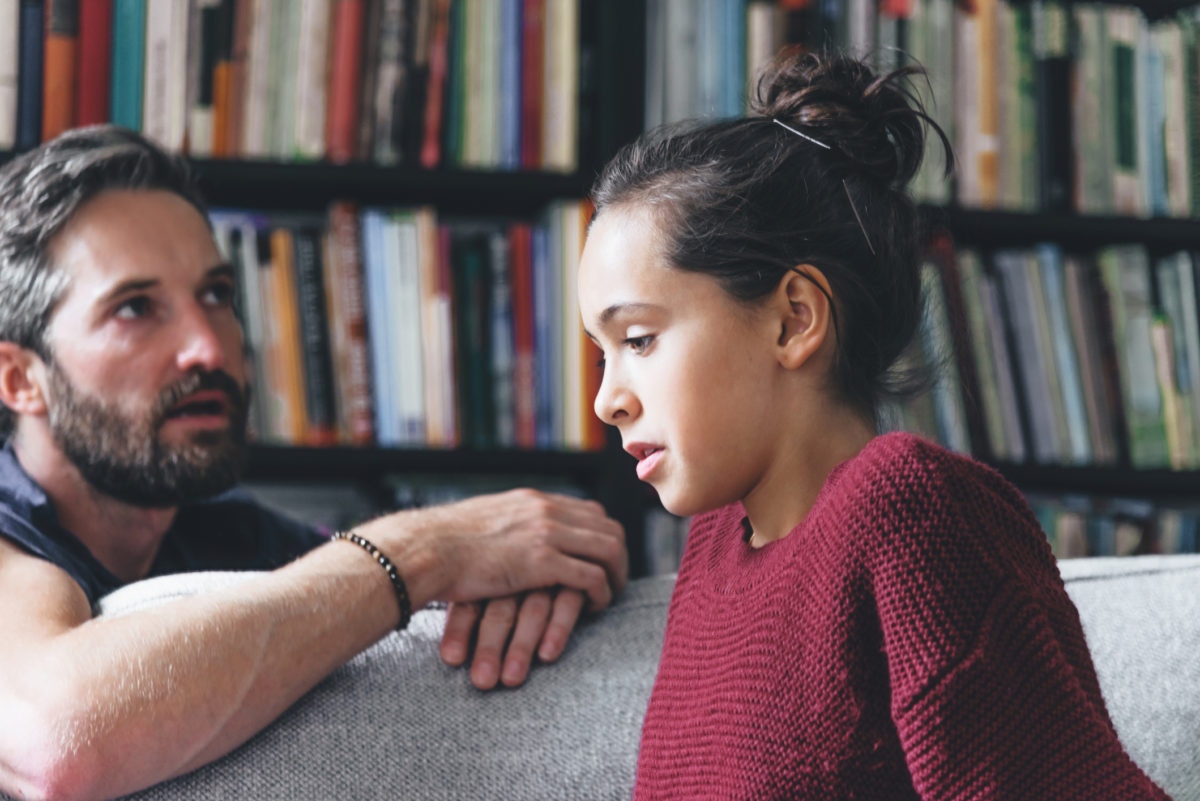 Father talks with his scared teenage daughter