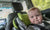 chubby baby in a child safety car seat