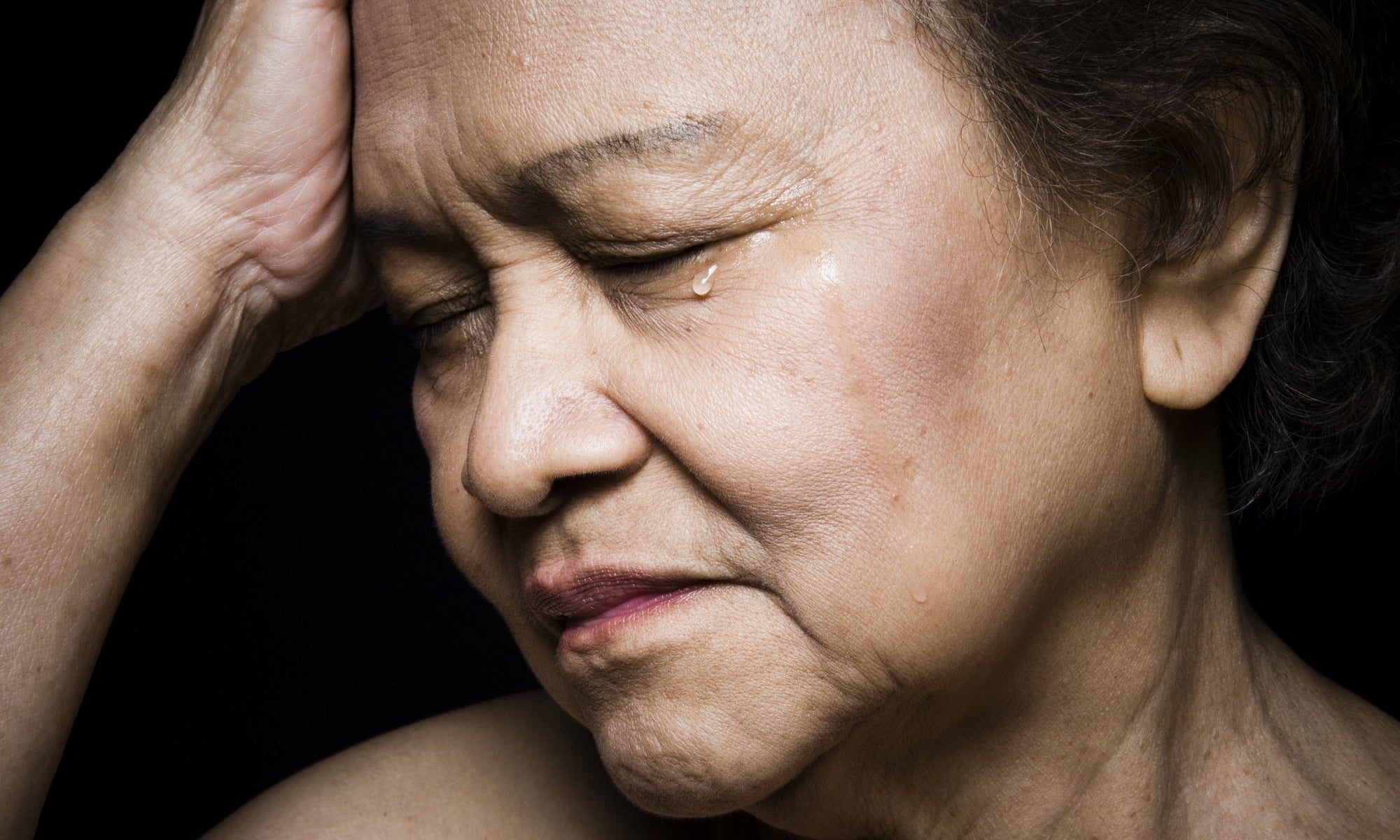 Old lady face with eye drop