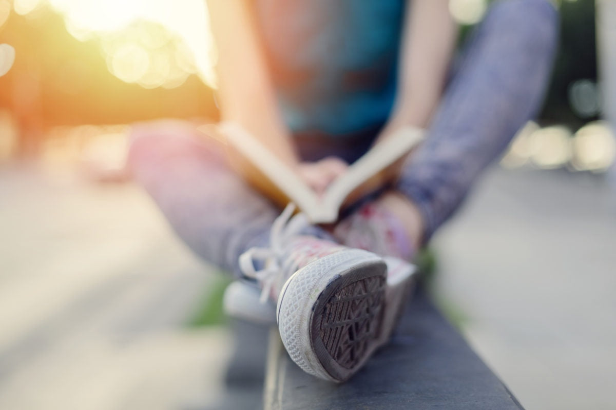 teenager reading a book