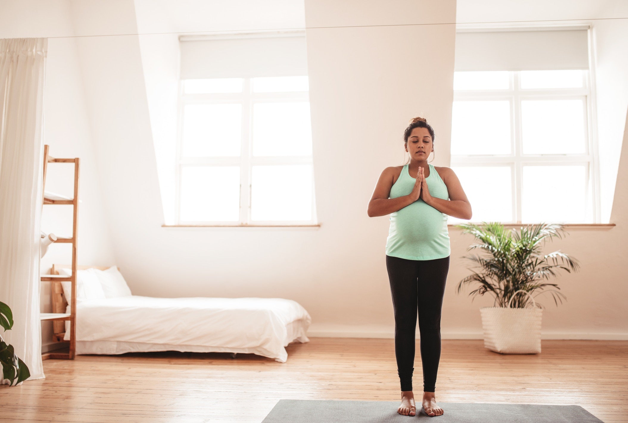 a pregnant lady doing yoga