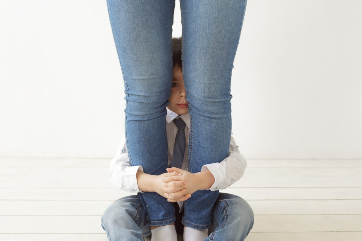 Child Hugging mother's Leg