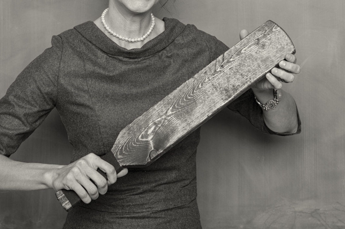 female holding a cricket bat