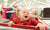 A child sitting on a shoping cart and crying