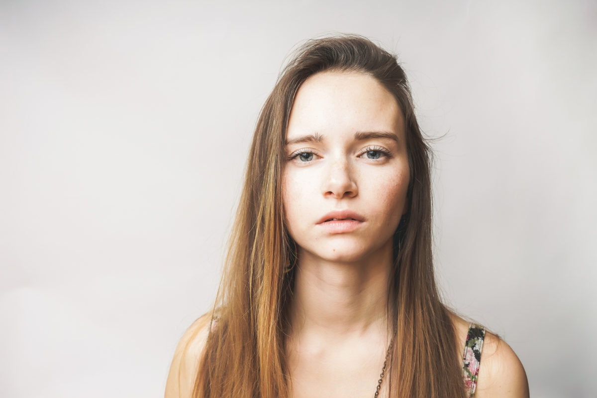 sad girl over white background