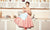 vintage woman drinking tea sitting in the kitchen.