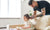 father cutting daughter's hair at home