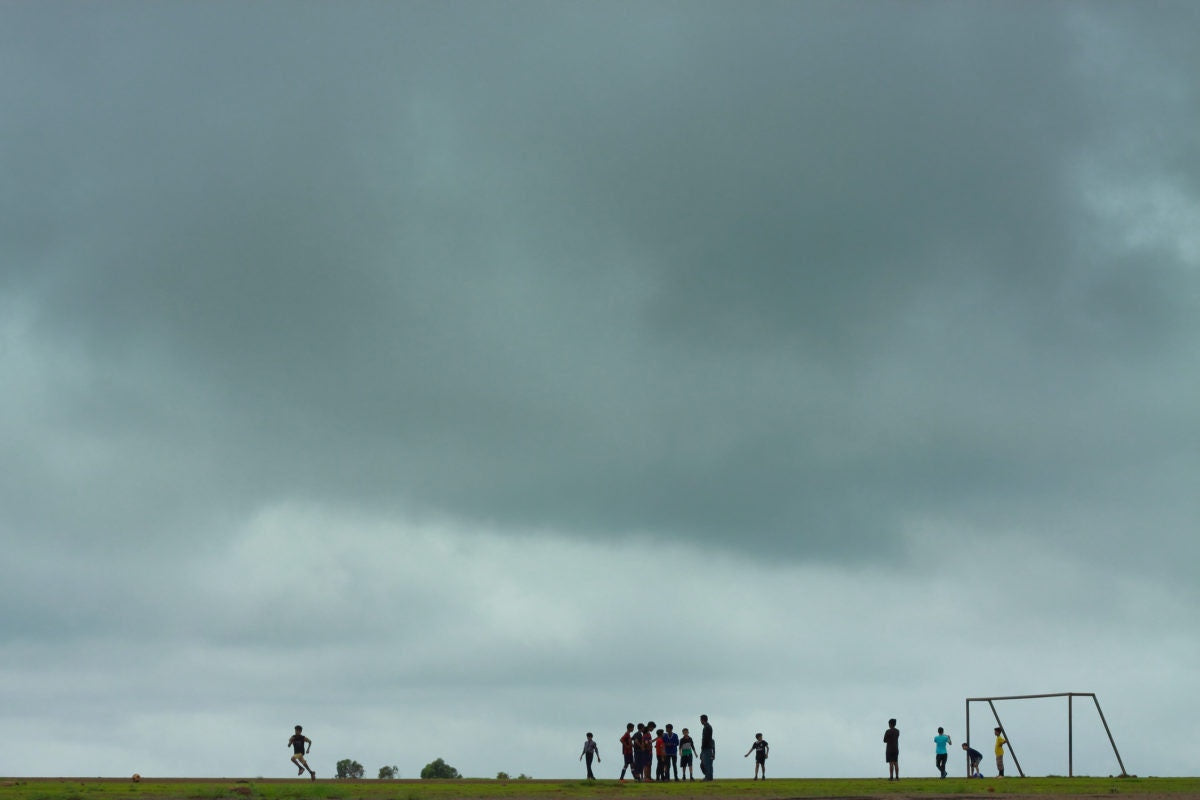 kids playing on a soccer field