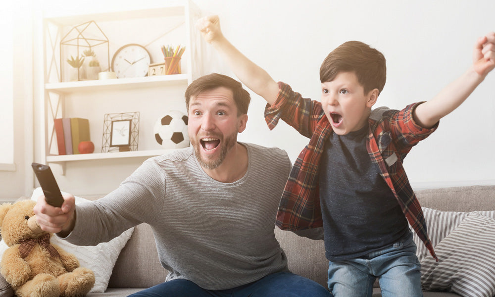 father and son watching sports