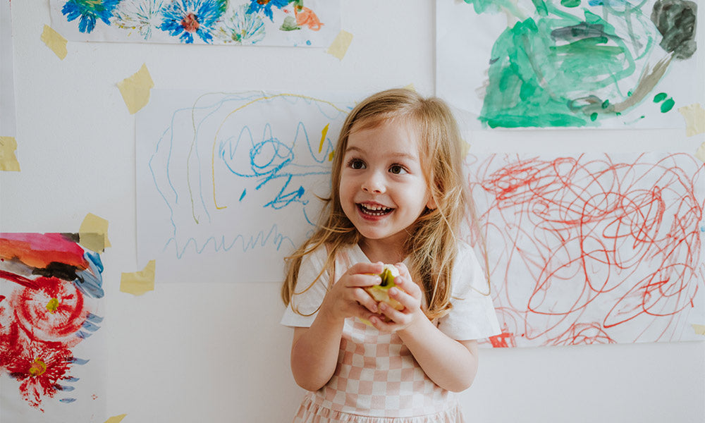 girl holding an apple 