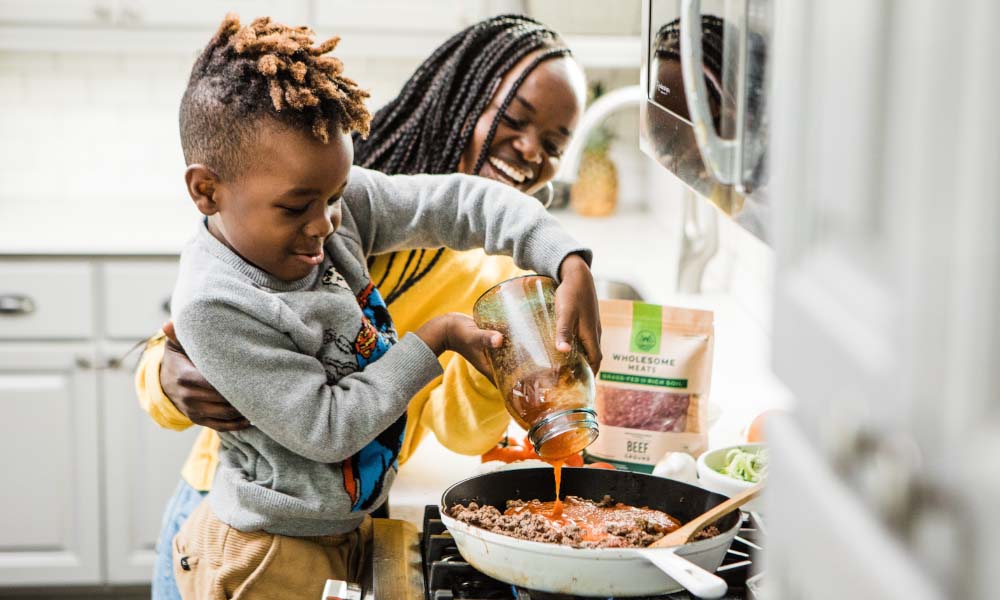 young boy and girl cooking